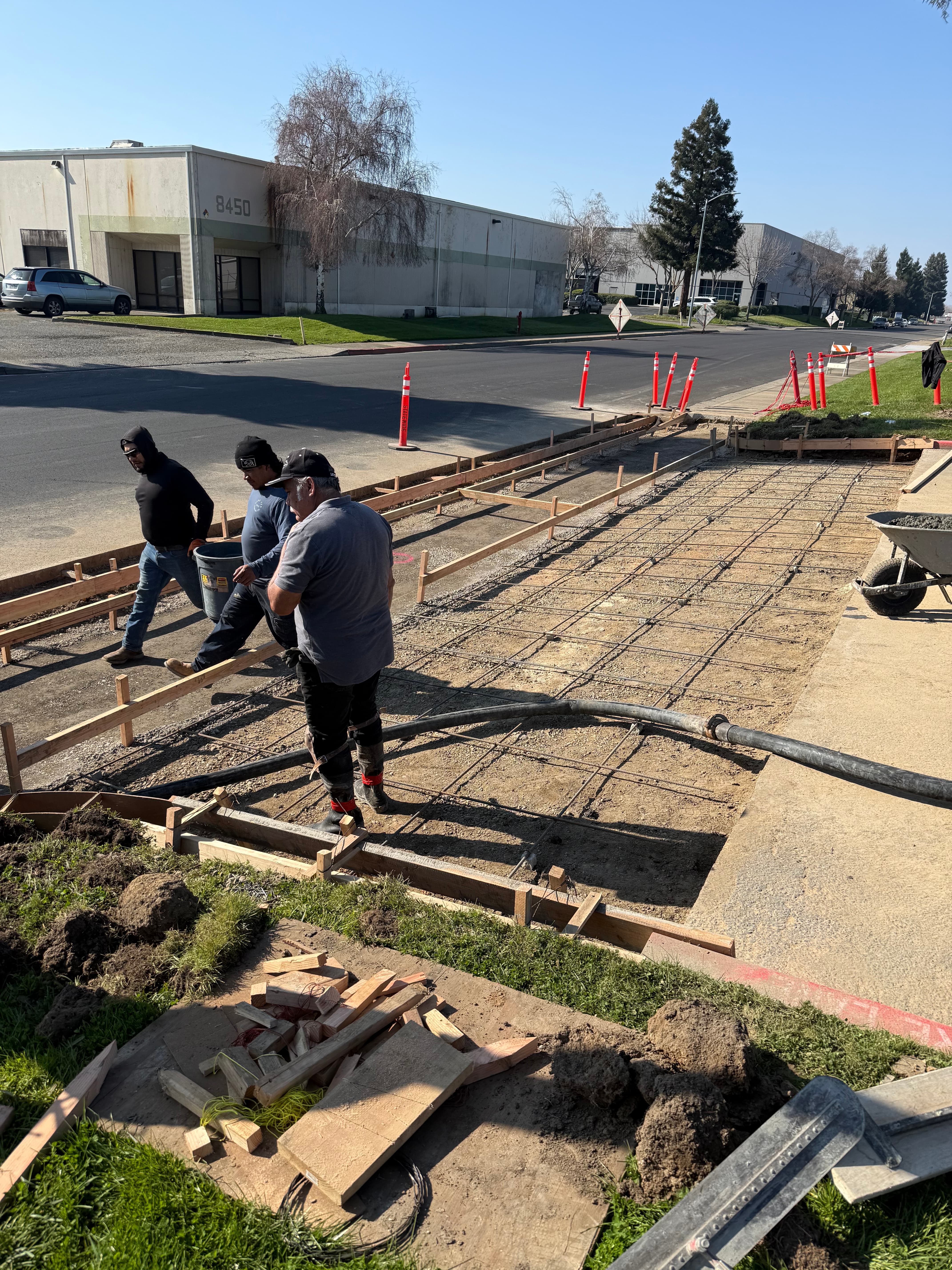 Crew screeding large commercial slab pour